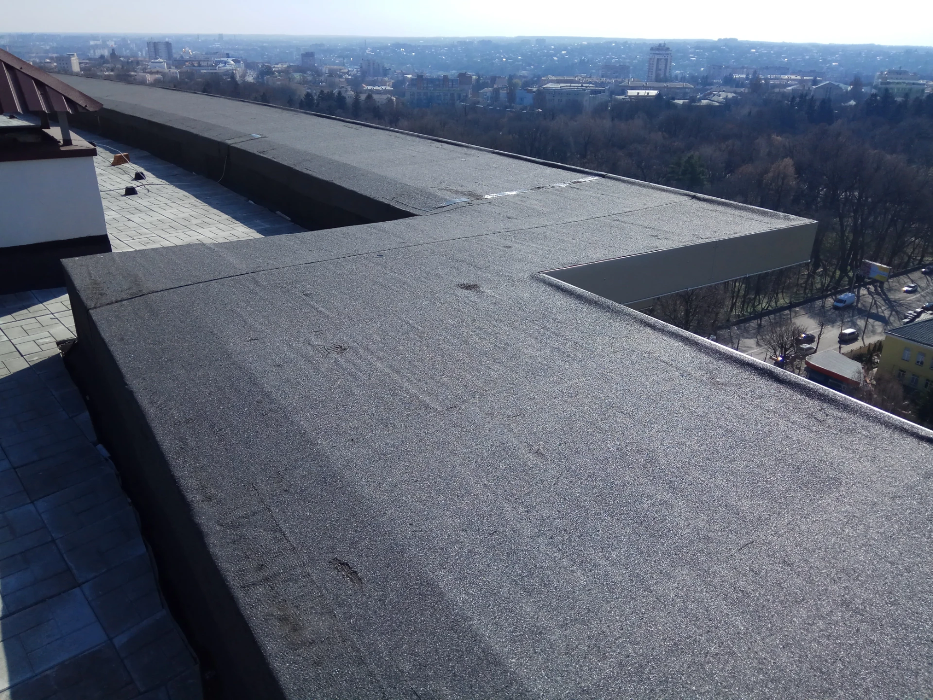 Completed flat roof surface running to its parapet edge on a Dorset building